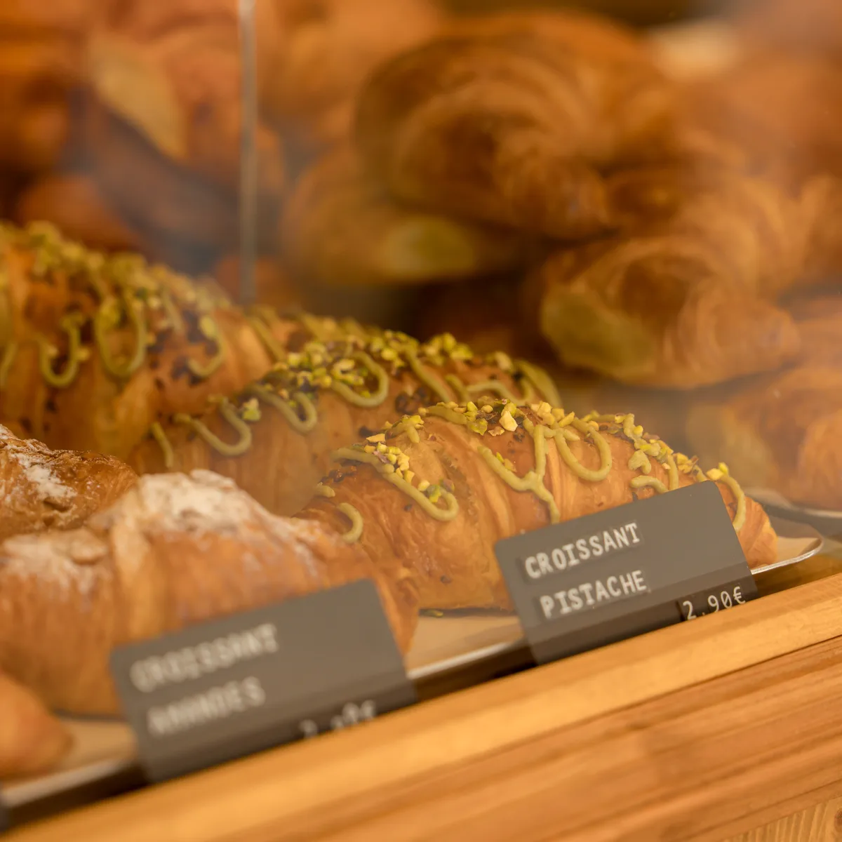 Pistachio croissants in the display case