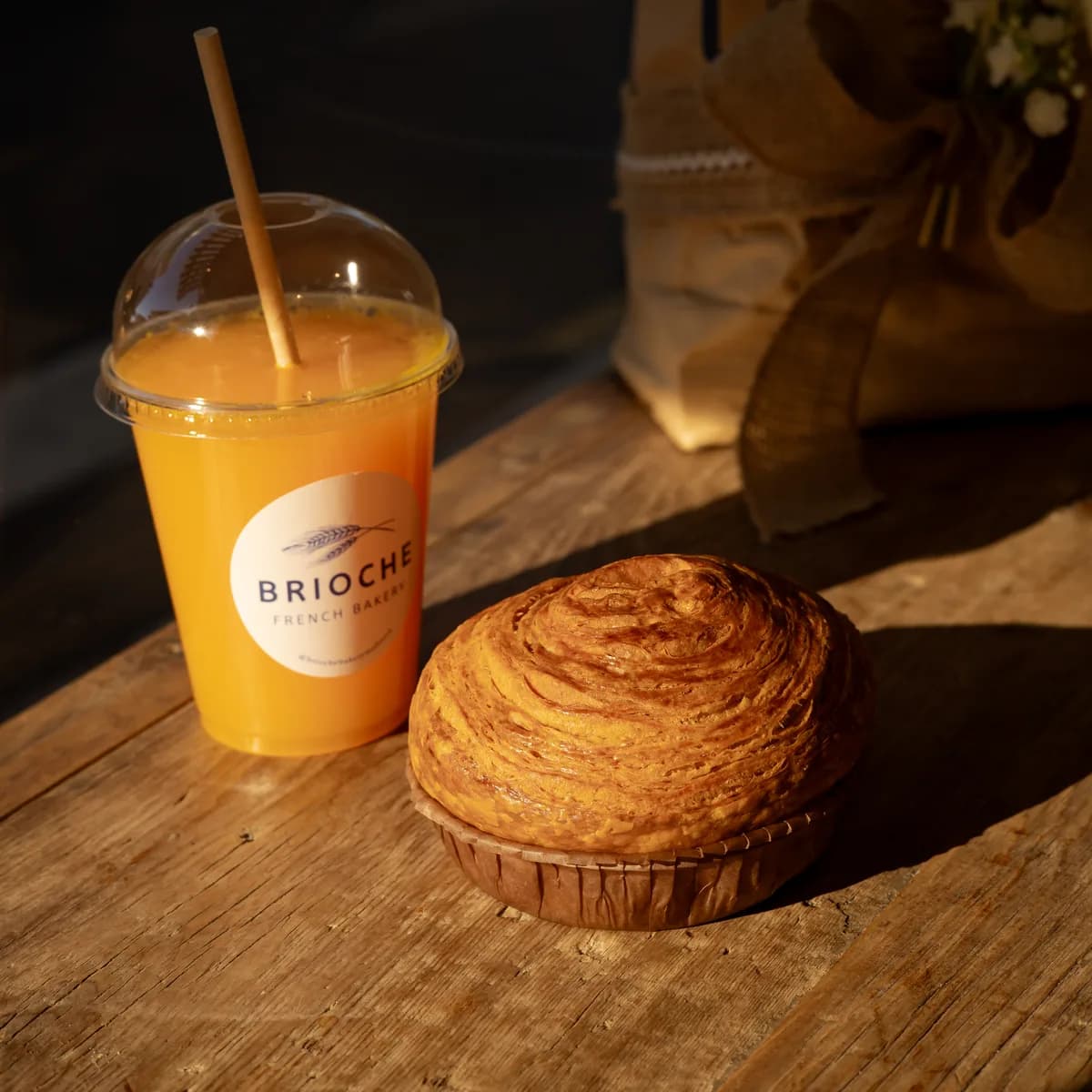 Fresh orange juice and a kouign-amann